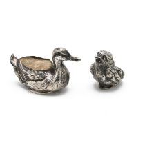 An Edwardian silver pin cushion in the form of a chick, Sheffield 1905, Sampson Mordan, along wit...