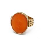 A yellow gold and hard stone seal ring, engraved with thistles, inscribed 'DINNA FORGET', tests a...