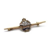 An 18ct yellow gold regimental sweetheart bar brooch, having The Royal Tank Corps crest, inscribe...