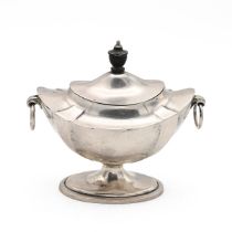 An Edwardian silver oval shaped sugar bowl, with ebony finial to the hinged cover, stepped base a...