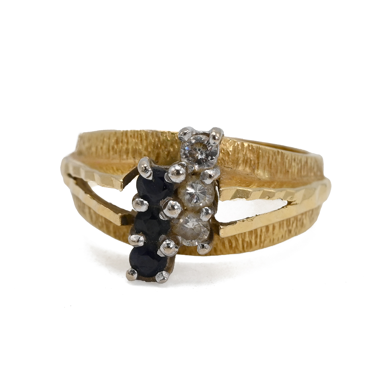 An 18ct gold sapphire and diamond Ring, set with three diamonds and three sapphires each connecte...