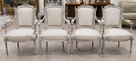 Set of four French 19th century Louis XVI style armchairs. Carved wood frames with ribbon detail ...