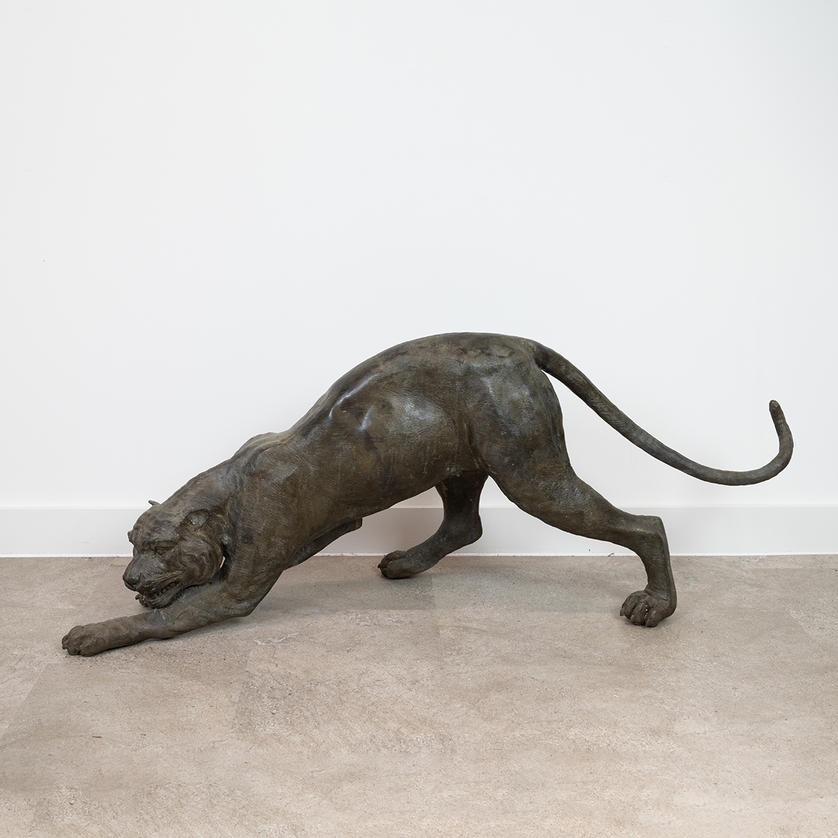 A large and well executed bronze sculpture of a prowling wildcat (puma/tiger). Approximate dimens...