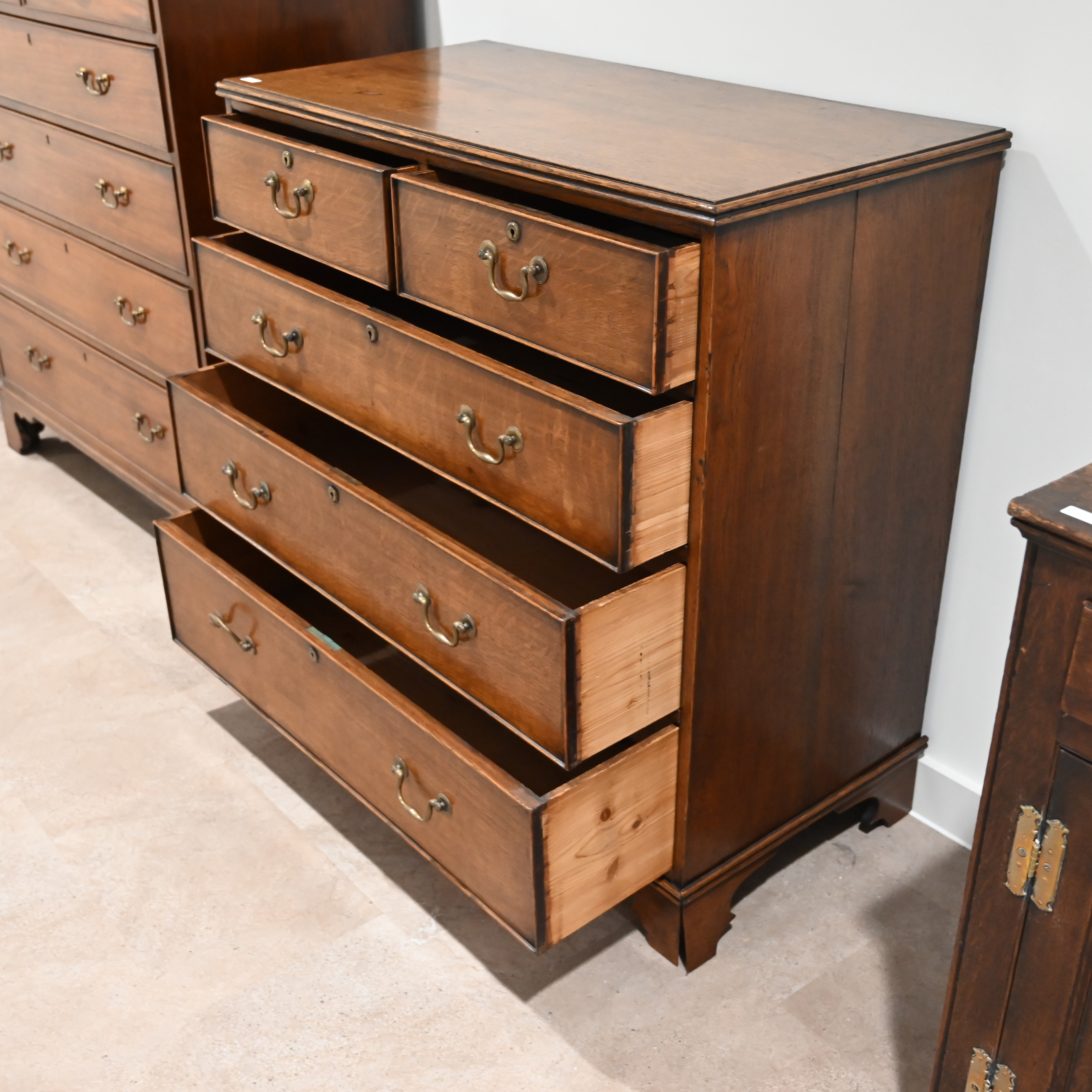 A late Georgian Oak chest of 2 over 3 drawers with brass handles. W 100cm, D 51cm, H 102cm. (C) - Image 3 of 3