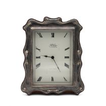 Silver framed and wooden cased quartz mantle clock by R. Carr of Sheffield. Provenance, acquired ...