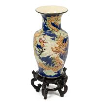 Oriental baluster form floor standing vase with polychrome design depicting a four toed dragon ch...