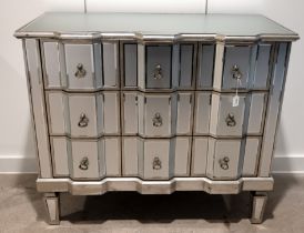 Contemporary Venetian style three drawer mirrored chest of drawers. Wooden frame with silvered fi...