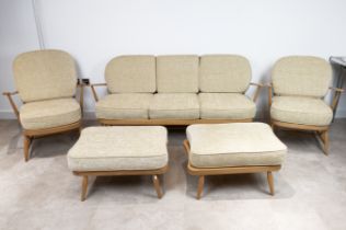 Vintage Ercol light elm suite from Windsor Range with blue Ercol stickers. Comprising a 203 sofa,...
