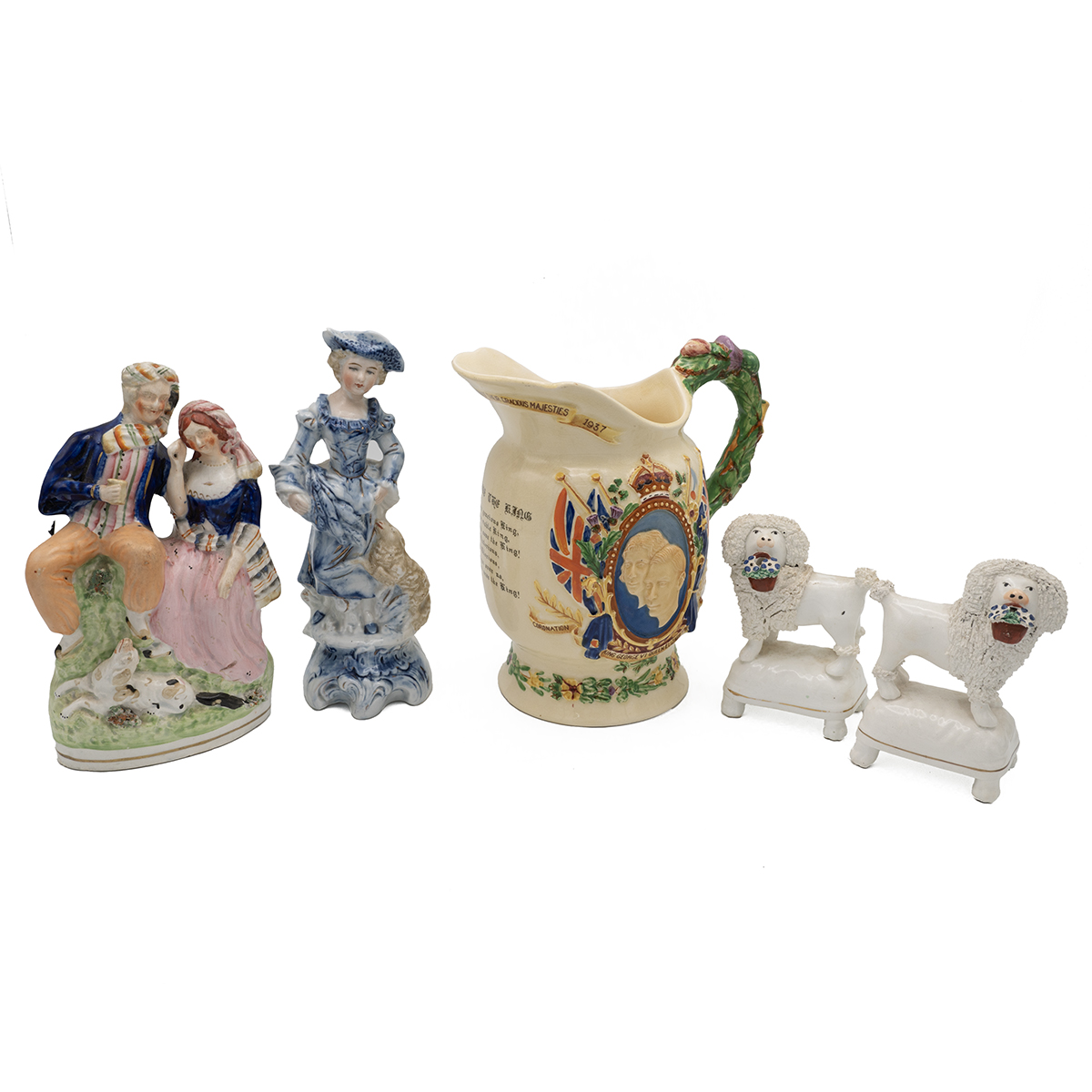 A good 19th Century Staffordshire flatpack of a courting couple, he with drink in hand and spanie...