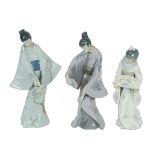 Three Lladro Nao porcelain figurines of Geishas with fans, two dated 1990. one 1977. Heights 30cm...