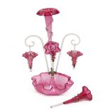 A Victorian four branch Epergne with central trumpet vase, two lateral trumpet vases and two clea...