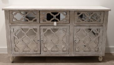 Contemporary decorative sideboard. Wooden frame with weathered white finish, quatrefoil design fr...