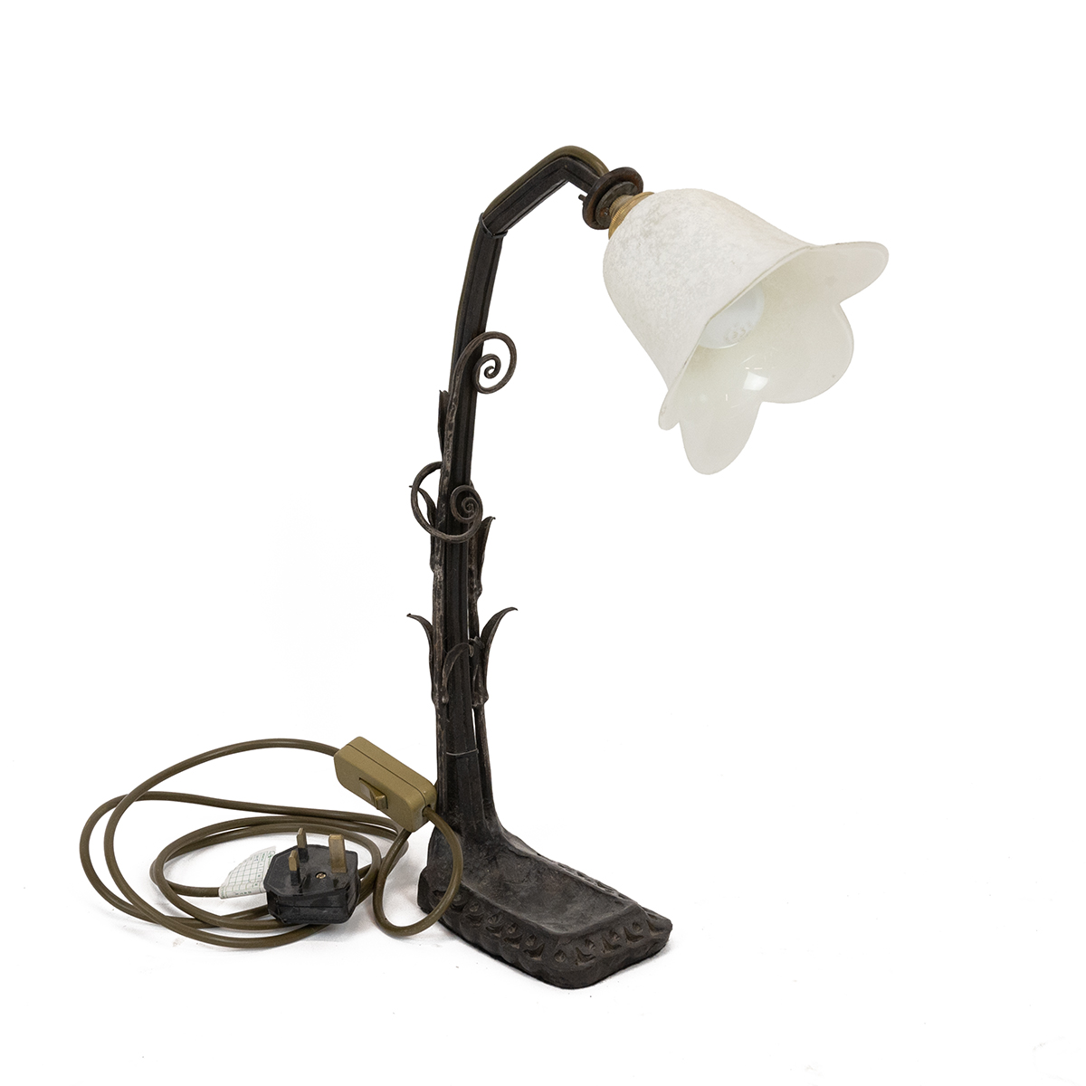 French early 20th century hand wrought iron desk lamp. Organic form with Fern leaves curling arou...