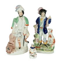 Two large 19th Century Staffordshire flatback figures of hunters - one with game and hound (41cm)...