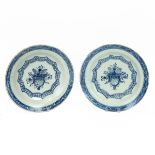 Delft - a pair of blue and white 18th Century Dutch Delft chargers with hand painted overglaze de...