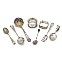 A collection of miscellaneous silver items including napkin rings, sifter spoon and other items, ...