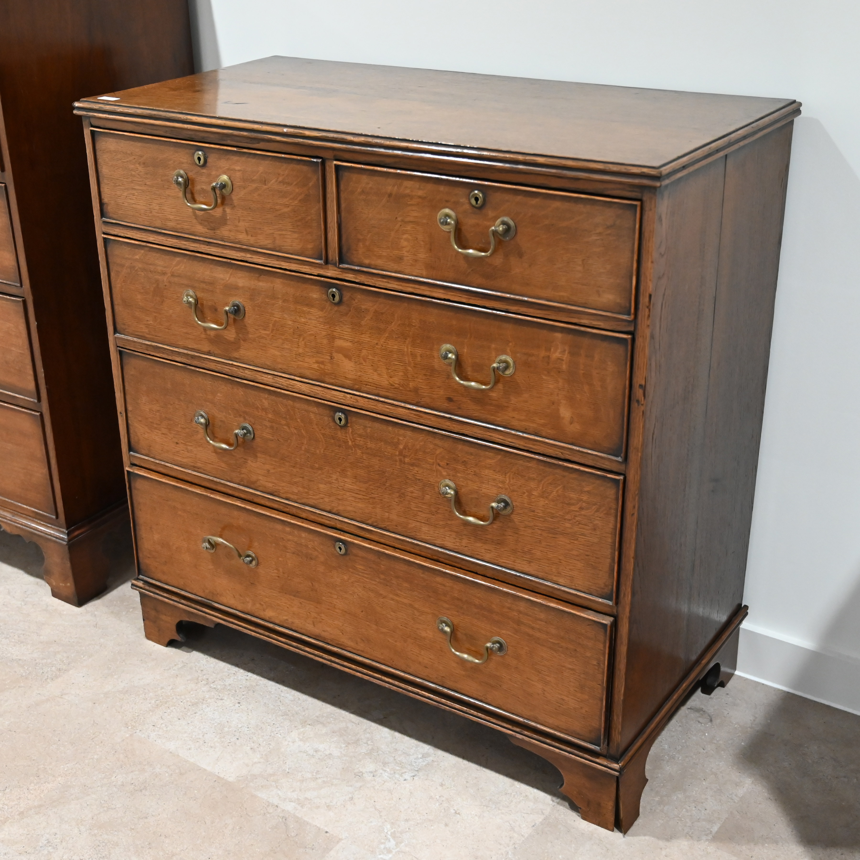 A late Georgian Oak chest of 2 over 3 drawers with brass handles. W 100cm, D 51cm, H 102cm. (C) - Image 2 of 3