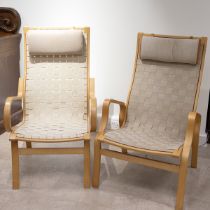 Two Danish mid century lounge chairs, 1970's. Laminate frames with lattice woven strap seat and b...