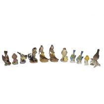 Royal Worcester - six porcelain bird figurines to include: Nightingale (a/f); Pied Woodpeckers; A...