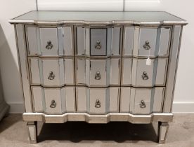 Contemporary Venetian style three drawer mirrored chest of drawers. Wooden frame with silvered fi...