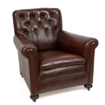 Art Deco button back club armchair. More recently upholstered in burgundy leather, on bun feet an...