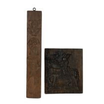 Two antique biscuit moulds. One single sided depicting a medieval priest on horseback (W 26cm, H ...