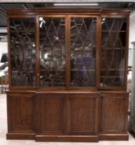 Georgian mahogany breakfront bookcase. Four cupboard doors below opening to reveal single shelf t...