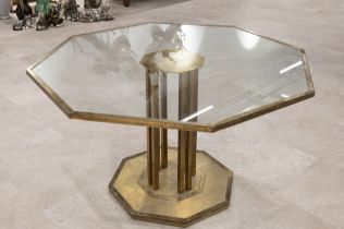 Mid century gilt metal octagonal coffee table c1950s. Octagonal base with 8 bars supporting a flo...