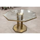 Mid century gilt metal octagonal coffee table c1950s. Octagonal base with 8 bars supporting a flo...