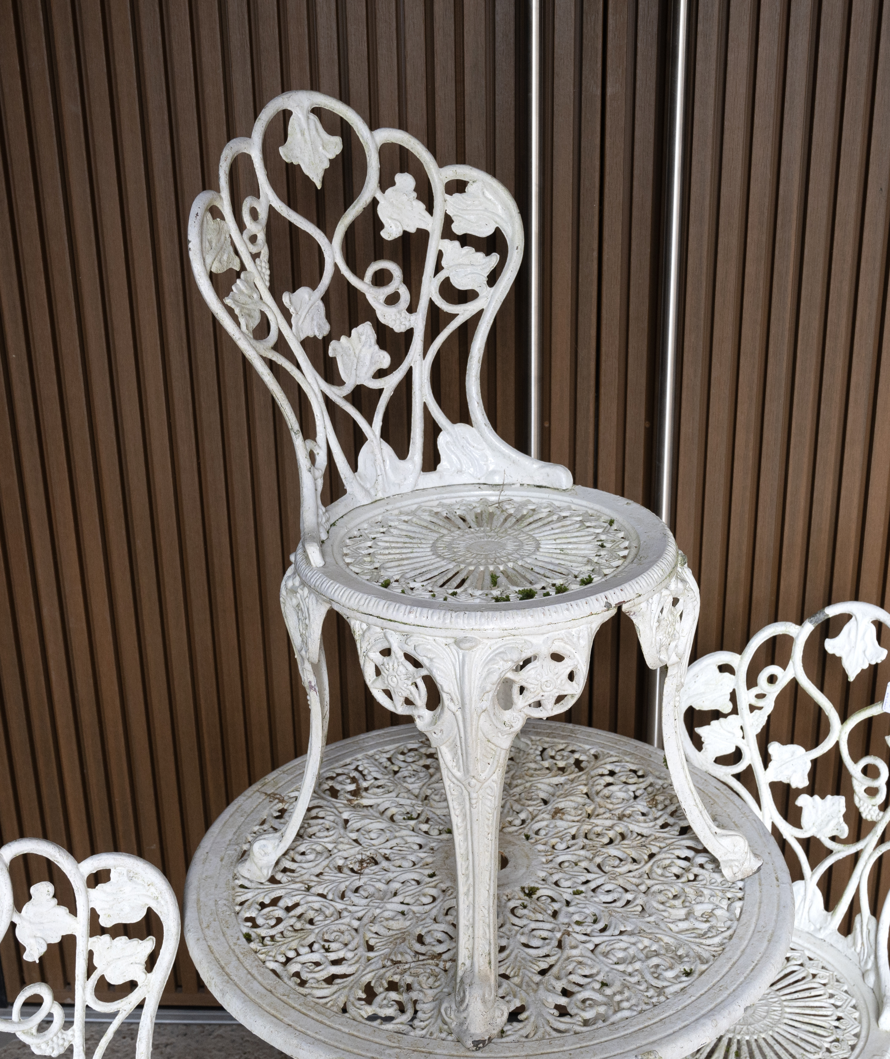 Painted metal garden circular table and four chairs. Vine leaf decoration to backs of chairs. Tab... - Image 2 of 2