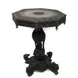 Antique Burmese table, profusely carved throughout. Hexagonal top with vine design and central fi...