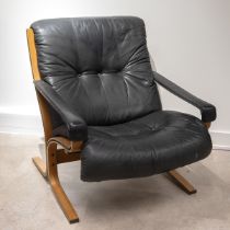 Danish mid century Westnofa lounge chair c1970's. Laminate frame with black leather cushioning an...