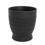 Keith Murray for Wedgwood - a black basalt vase, with textured chevron frieze design, on a circul...