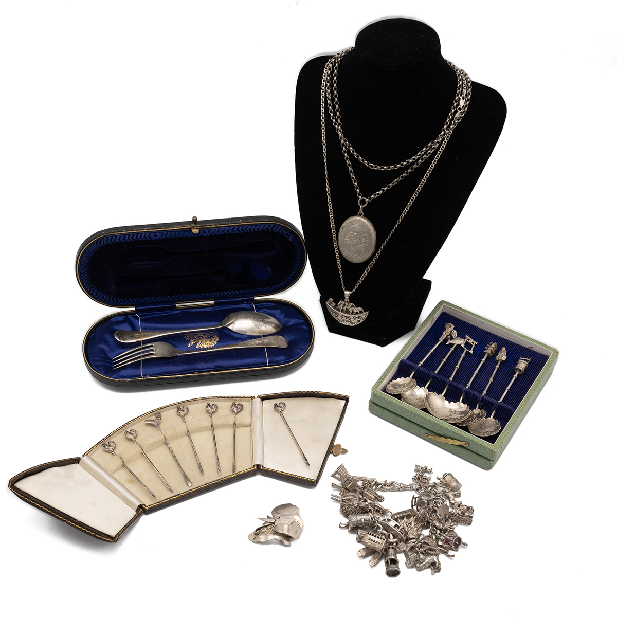 A silver christening set, along with a set of silver cocktail sticks each with a cockerel finial,...