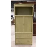 Vintage American media cabinet. Wooden frame with central rolling front doors, two rattan-fronted...