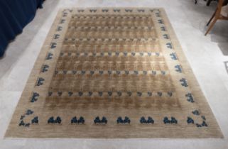 Contemporary hand knotted woollen rectangular rug, tones of browns and blue with Arts & Crafts in...