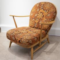 Ercol model 203 light elm lounge chair with 60's orange and brown floral fabric cushions. (C)