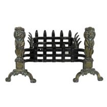 Late 19th or early 20th Century wrought Iron fire basket flanked by seated brass lions to the fro...