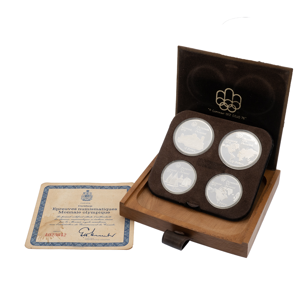 1973 Canada Montreal Olympics 4-coin silver proof set in the original wooden box. Includes (1) 19...