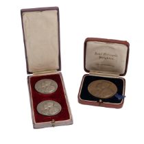 Three (3) 1937 King George VI coronation medals in silver and bronze, all with an obverse design ...