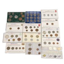 Thirteen (13) world coin sets, the coins primarily dating from the 1960s, largely uncirculated. I...