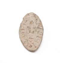Medieval lead vesicle seal with a central fleur-de-lis pattern and an inscription around (not dec...