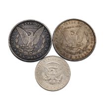 Three (3) United States 900 silver Morgan Dollars and Kennedy Dollar. Includes (1) 1878-CC Carson...