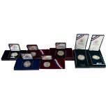 Seven (7) USA 900 silver proof $1 coins in original United States Mint packaging. Includes (1) 19...