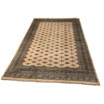 Large Contemporary Bukhara pattern hand made rug. Cream/ Camel coloured ground with black geometr...
