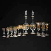 A pair of slender teardrop shaped 19th century continental liqueur or cordial decanters with gilt...