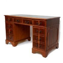 Late 20th Century yew wood twin pedestal desk with tooled green leather top over six drawers and ...