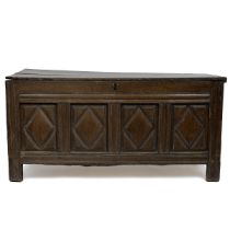 Late 17th or early 18th Century oak coffer with four geometric carved panels to front, the  two p...