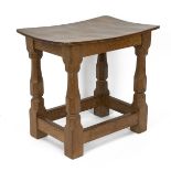 Robert Mouseman Thompson, Kilburn: An English Oak Stool, with a solid top, on four octagonal legs...