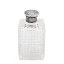 Cut glass cologne flask with silver screw top of square form with diamond cut pattern. H 9.5cm.